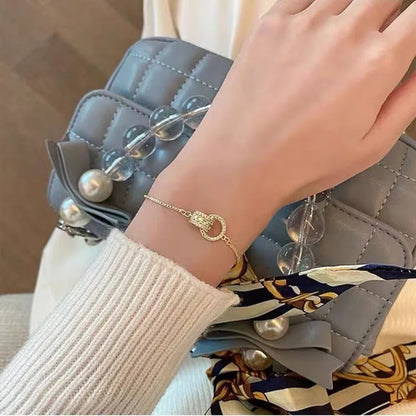 Interlocking Gold Charm Bracelet