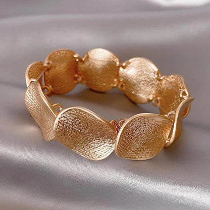 Interlocking Gold Charm Bracelet