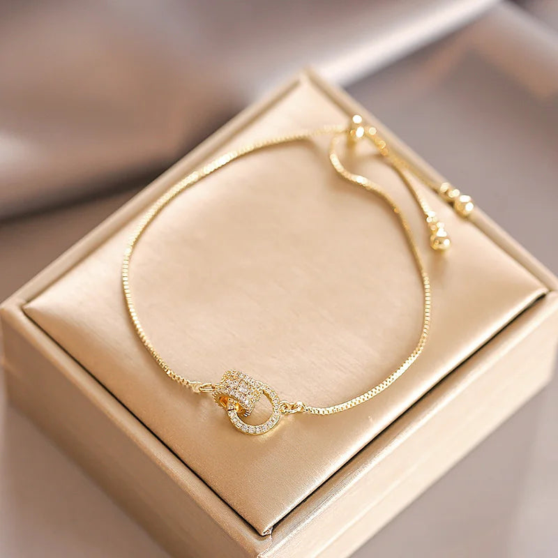 Interlocking Gold Charm Bracelet
